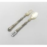 A pair of mid 19th century French silver handled and mother of pearl salad servers by Philippe
