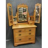 A satin walnut Edwardian mirror backed, six drawer dressing table on castors 174 x 100 x 49cm.