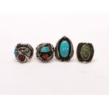 Four Native American silver stone set rings.