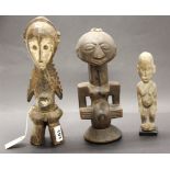 A carved and painted Lega wooden female figure, together with a small Lobi Ivory Coast alter