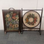 An oak fire screen with glass protected embroidery together with a mahogany beadwork screen, tallest
