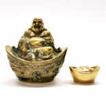 A Chinese bronze / brass figure of Putai seated on a silver weight, H. 11cm, together with a gilt