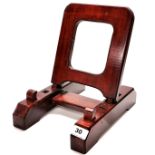 A handmade mahogany adjustable stand for large porcelain chargers or similar items, 29 x 21 x
