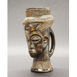 An African carved wooden tribal figural drinking vessel Bar, Cuba. H. 26cm. Prov. Estate of the late