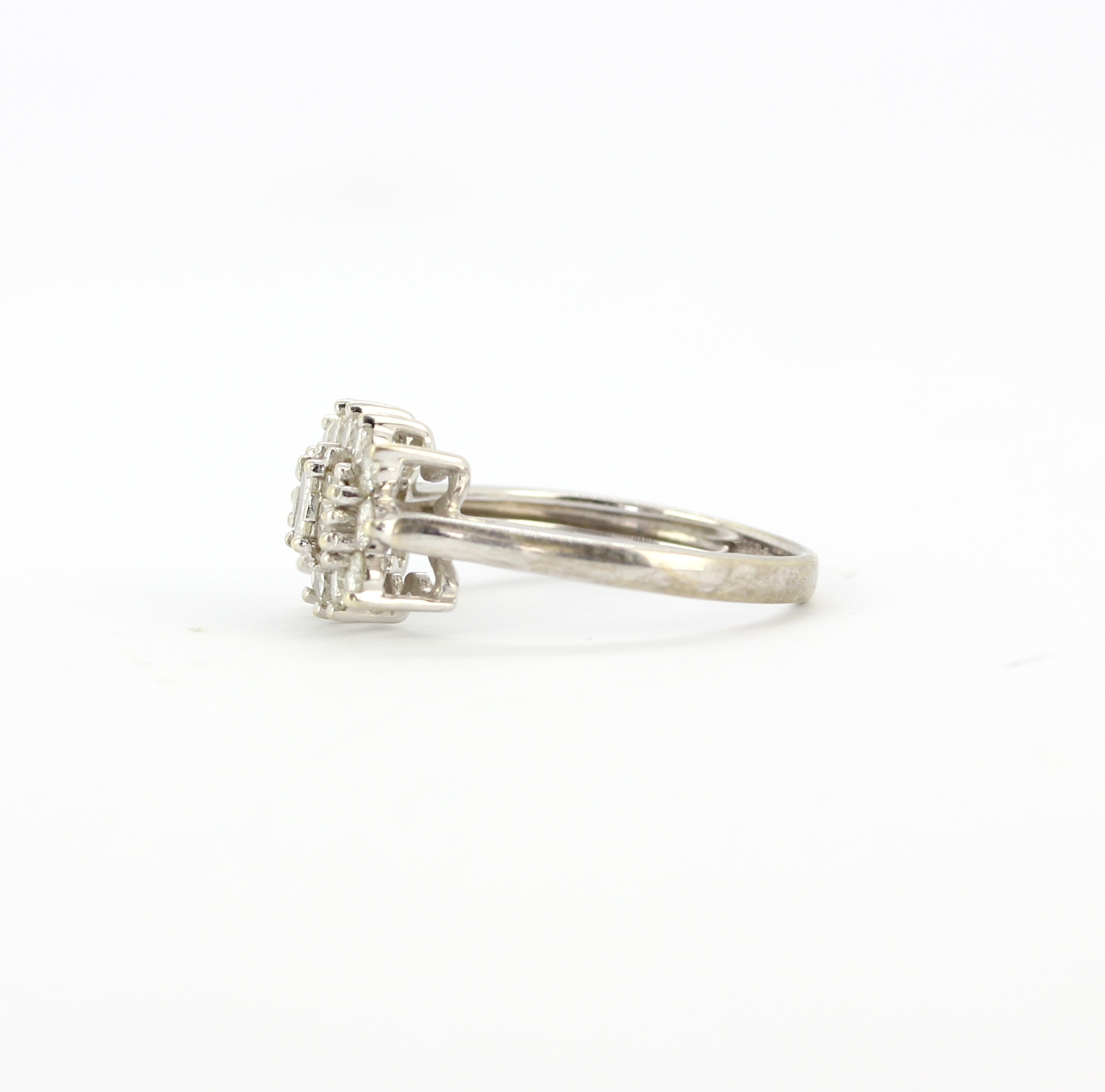 A hallmarked ring set with baguette and brilliant cut diamonds, (M). - Image 3 of 3