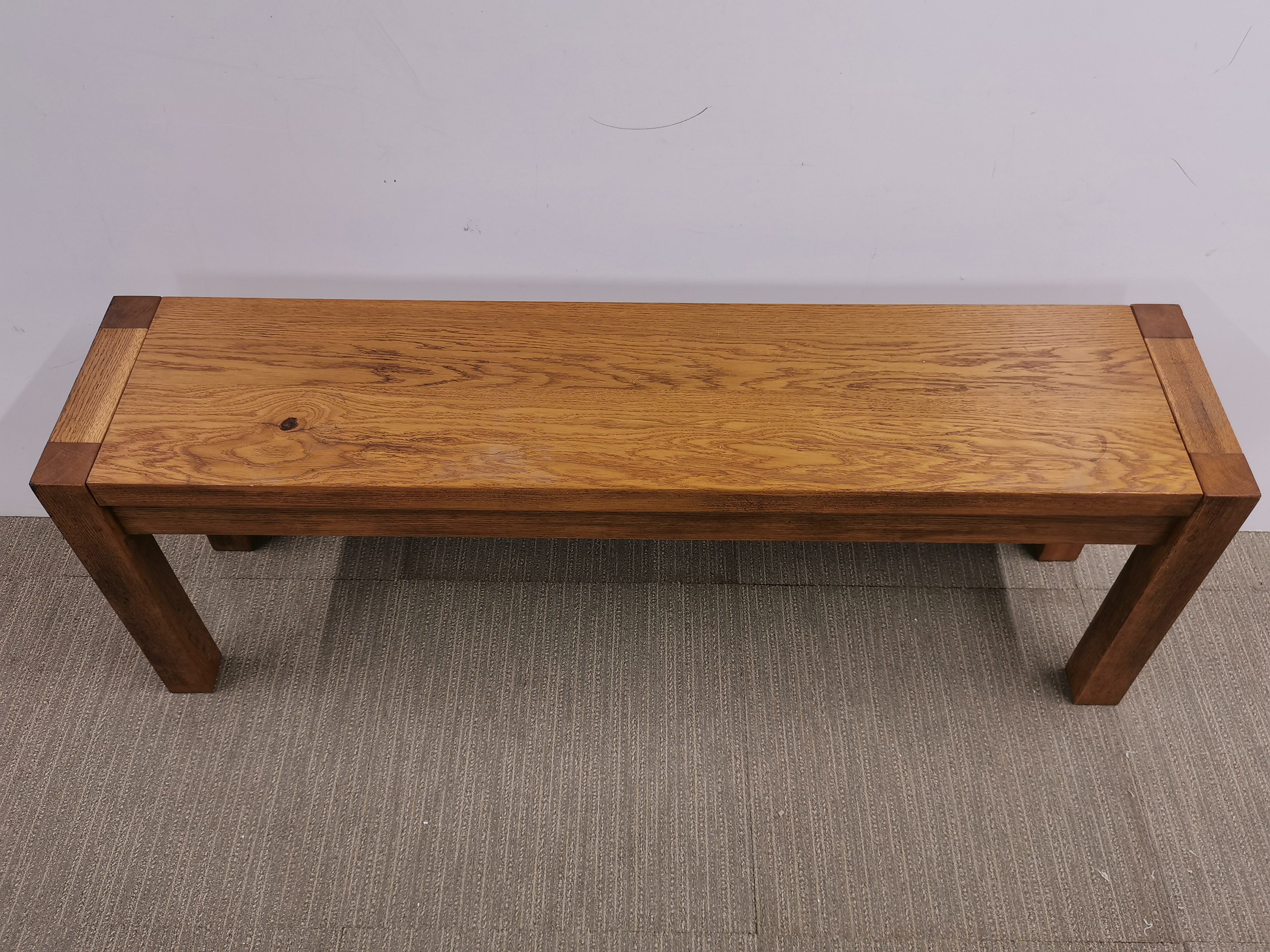 A heavy oak coffee table, 130 x 29 x 46cm. - Image 2 of 3