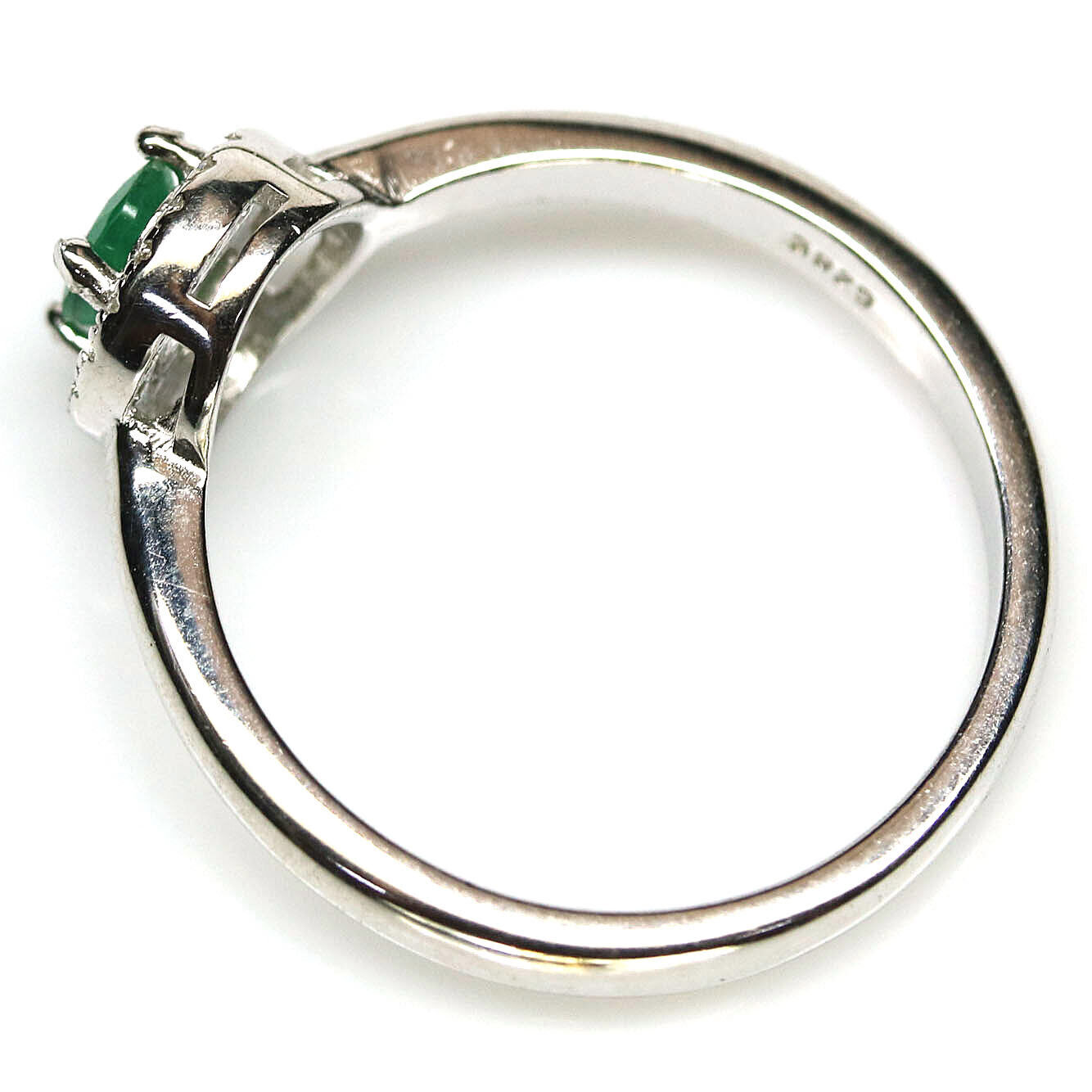 A 925 silver cluster ring set with an oval cut emerald surrounded by white stones, (N.5). - Image 2 of 2