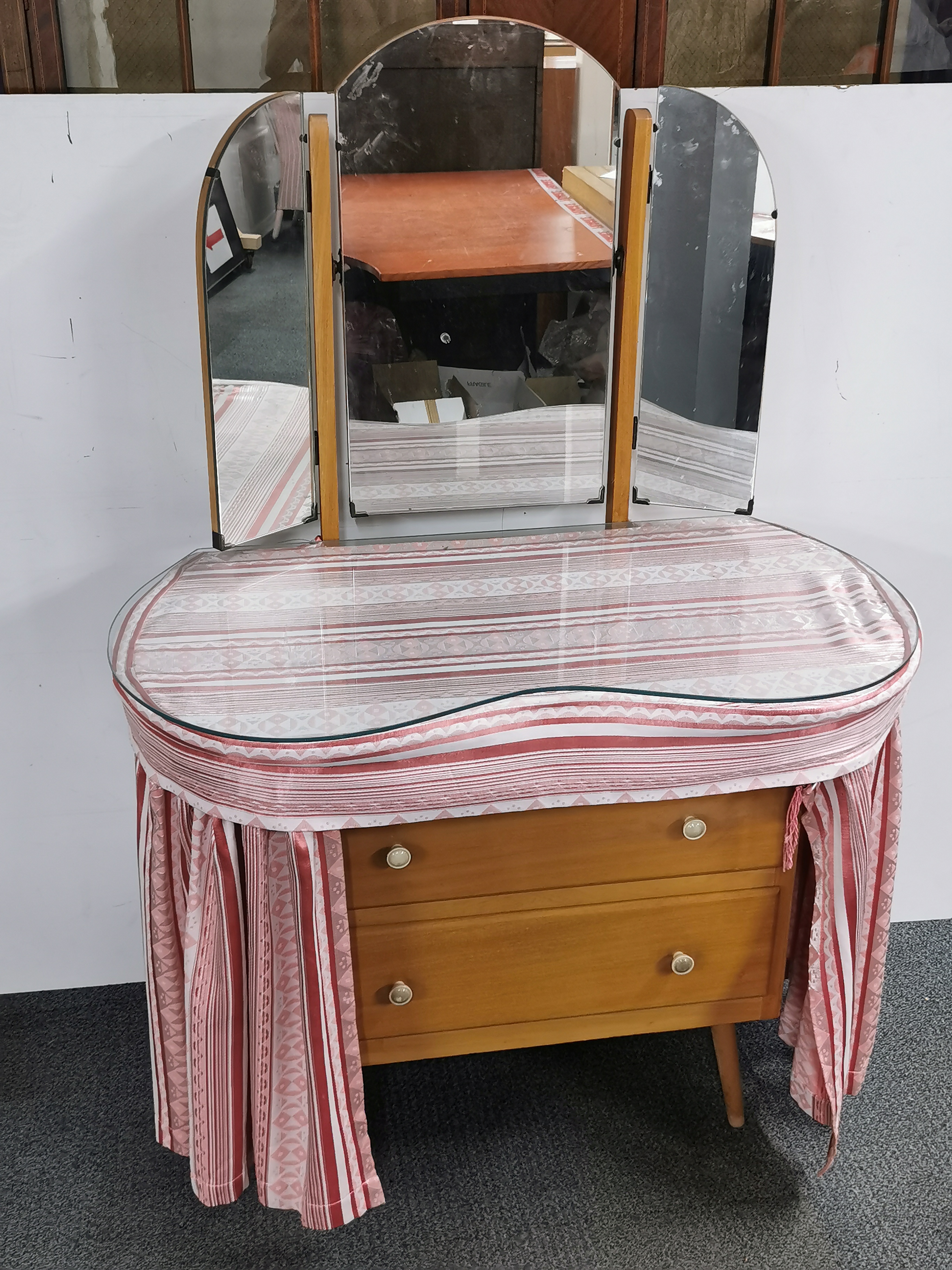 A mirror backed pine dressing table with plate glass top, 91 x 127cm.