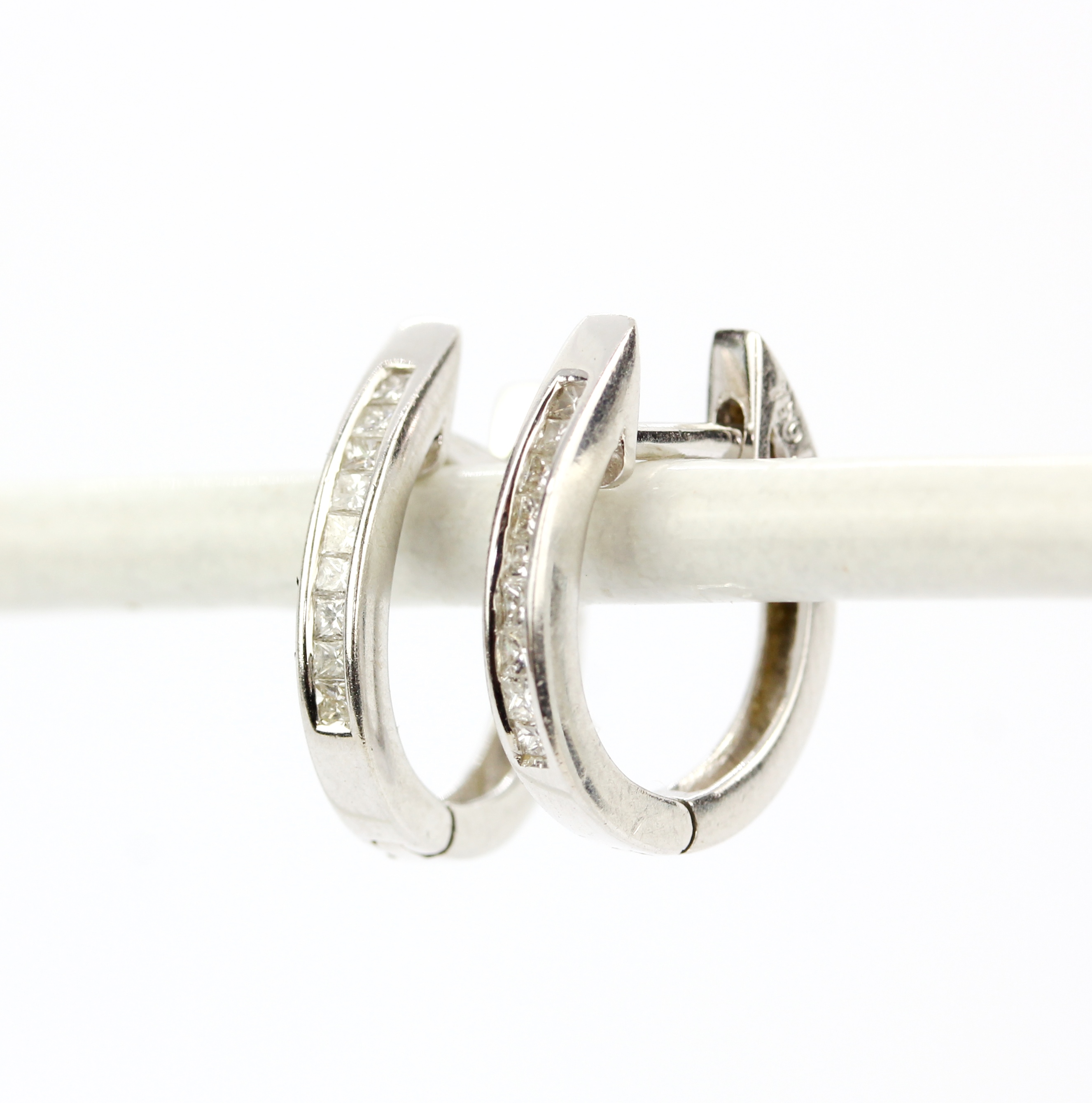 A pair of 18ct white gold hoop earrings set with princess cut diamonds, L. 1.5cm. - Image 2 of 2