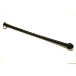 An early long handled rubber truncheon or defence stick, probably c. 1890. L. 74cm.Prov. Estate of