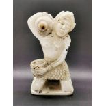 An Eastern carved marble figure of a woman carrying a flagon of water, H. 22cm.