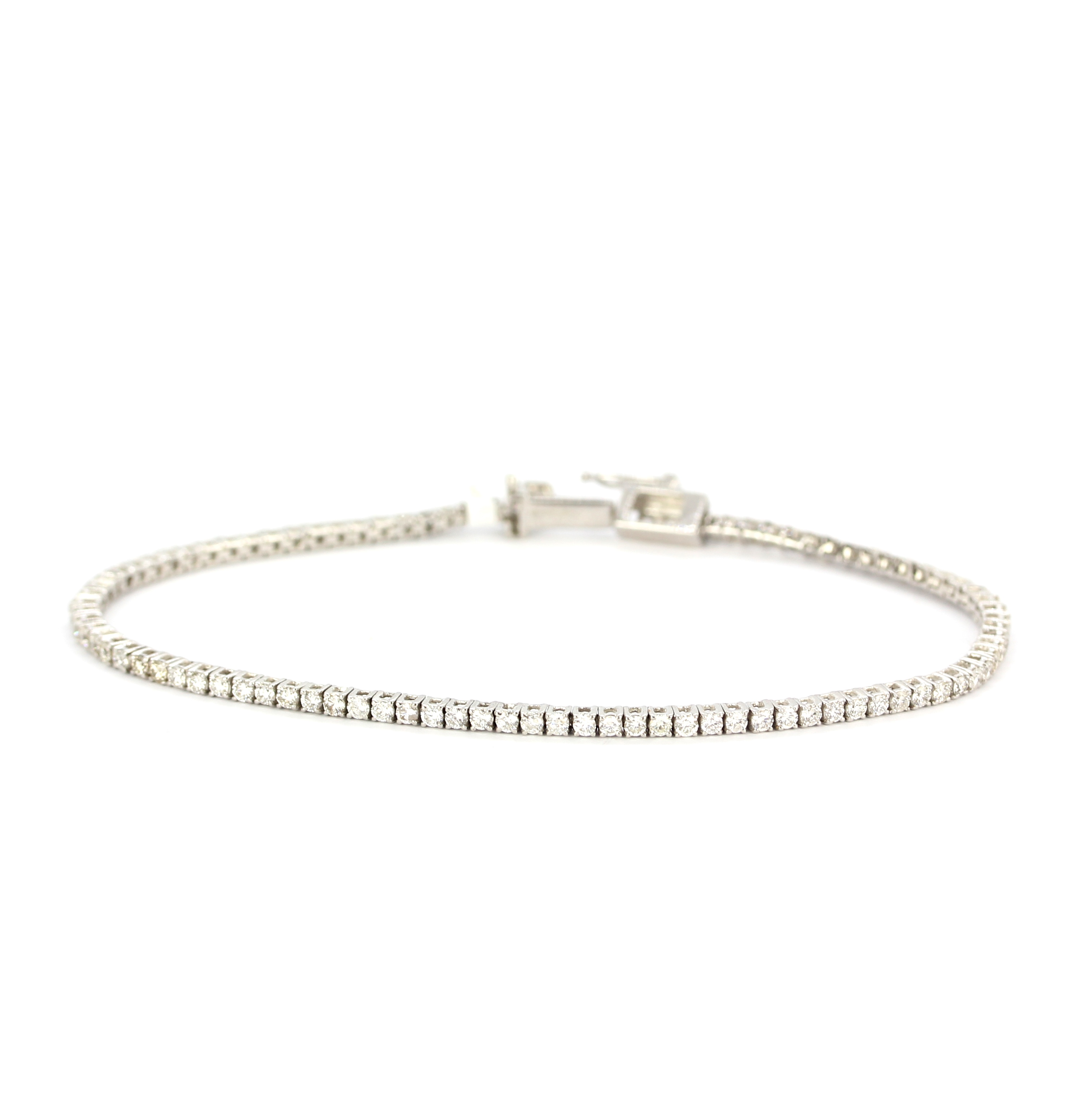 An 18ct white gold tennis bracelet set with brilliant cut diamonds, approx. 2.25gr total, L. 19cm. - Image 2 of 4