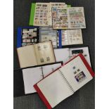 A group of stamp albums.