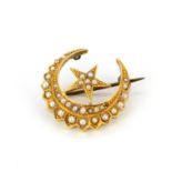 A Victorian 18ct yellow gold brooch set with graduated seed pearls and a rose cut diamond, L. 2.5cm.