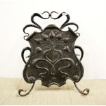 An Art Nouveau hammered copper and iron fire screen, H. 71cm.