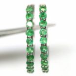 A pair of 925 silver hoop earrings set with round cut emeralds, Dia. 2.2cm.