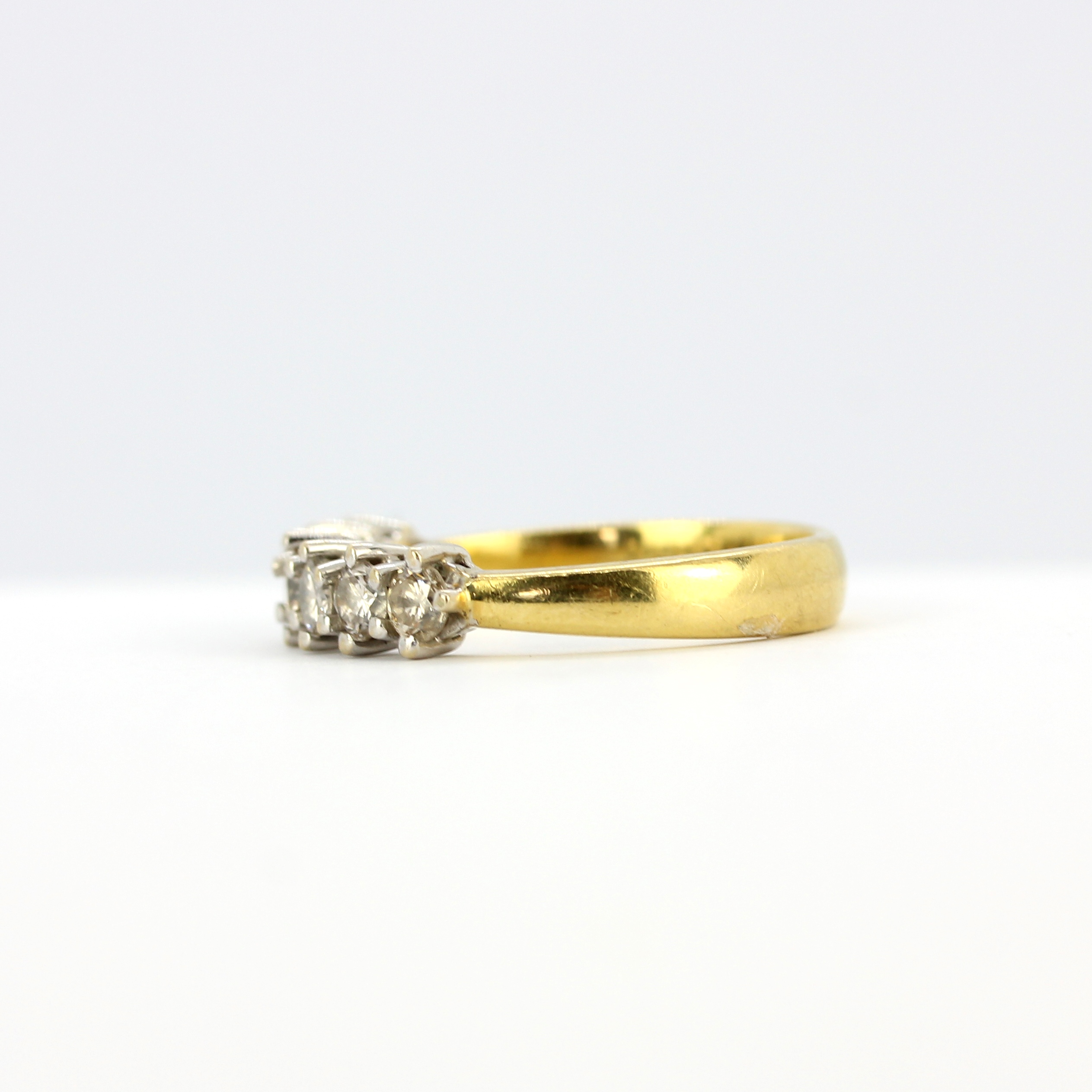 An 18ct yellow gold ring set with brilliant cut diamonds, (N), approx. 0.70ct total. - Image 3 of 3