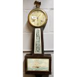 An early 20th century American 'banjo' wall clock, H. 79cm. (Understood to be in working order).