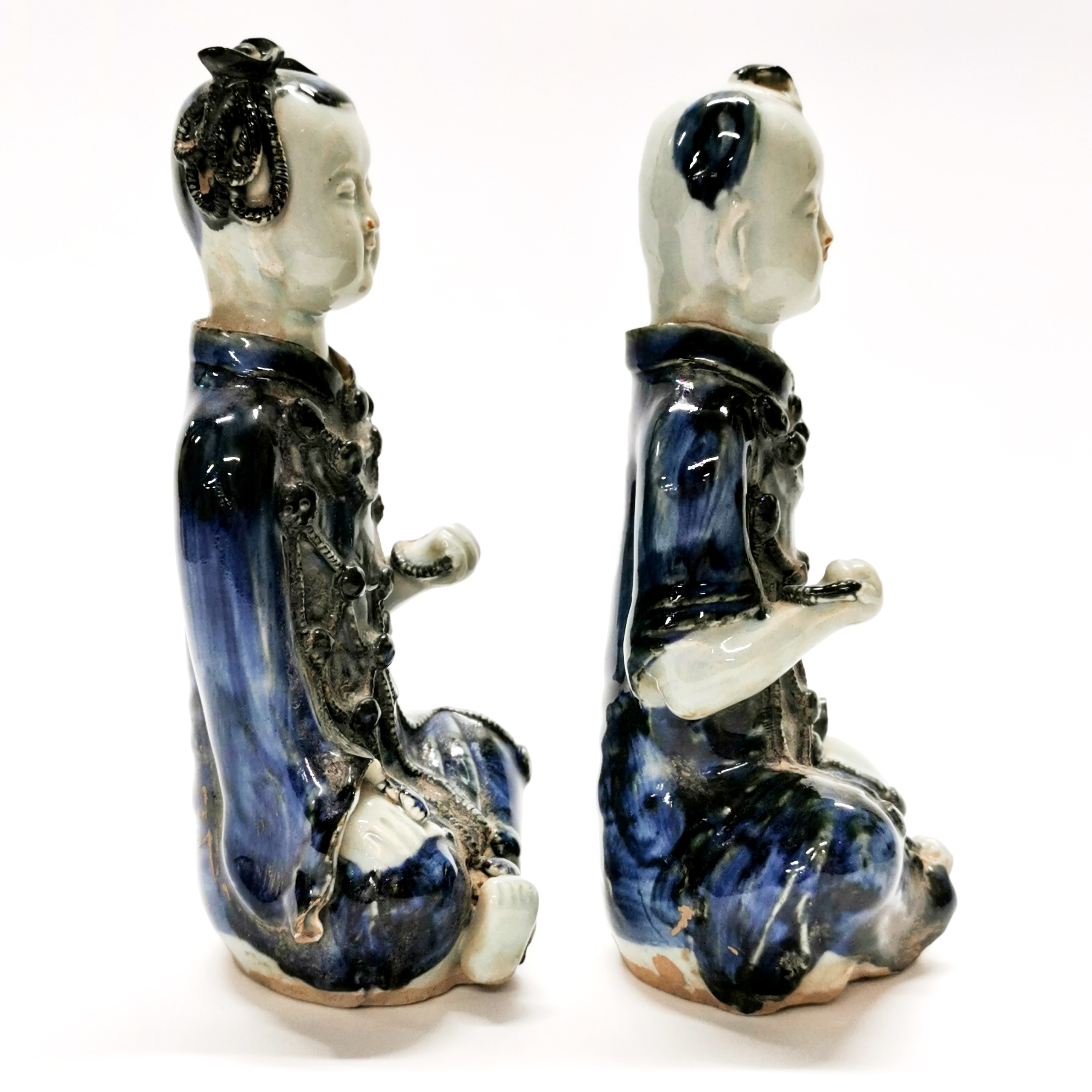 A pair of interesting Chinese glazed handmade porcelain figures of a boy and a girl, H. 23cm. - Image 2 of 4