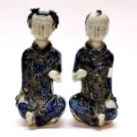 A pair of interesting Chinese glazed handmade porcelain figures of a boy and a girl, H. 23cm.