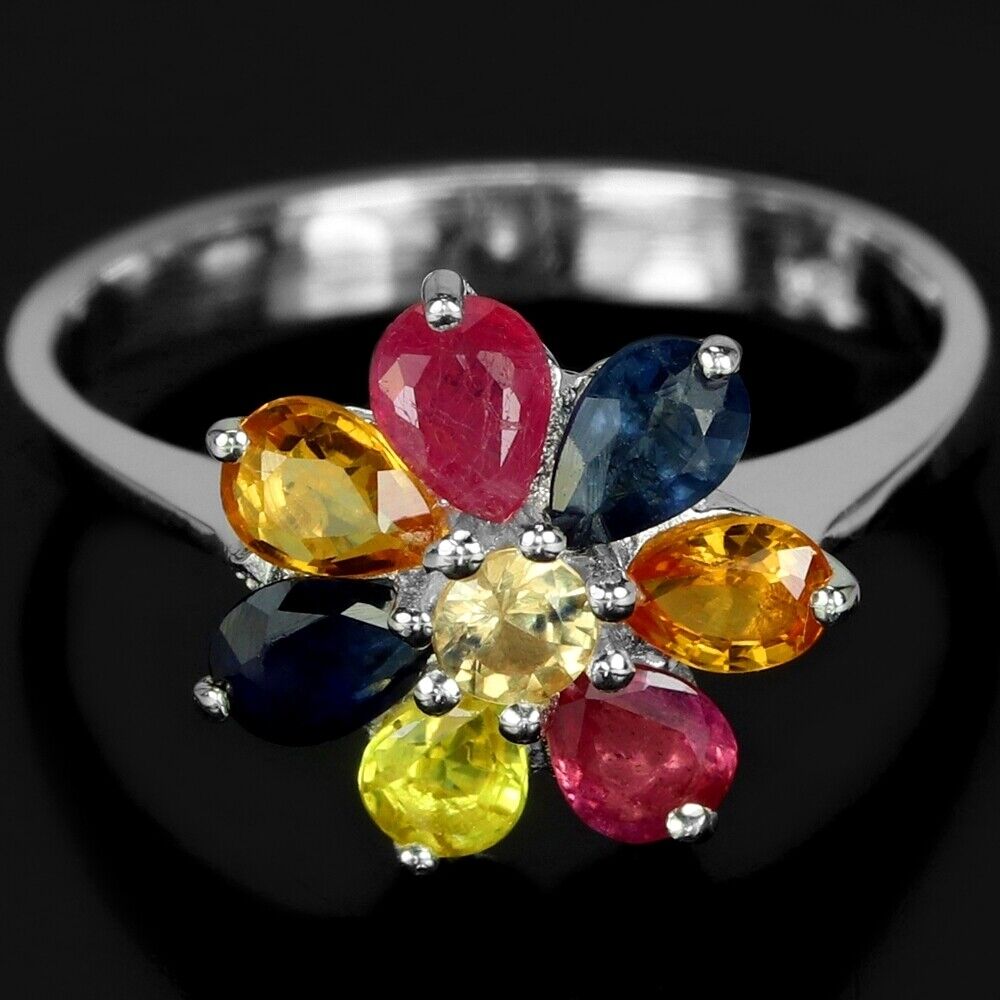 A 925 silver flower shaped ring set with oval cut sapphires and fancy colour sapphires, (M).