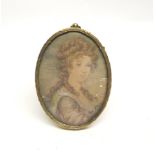 A gilt framed miniature pastel portrait of a girl, frame size 8 x 10cm.