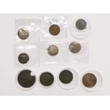 A group of early coins and tokens.