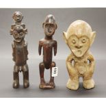 A group of three small African carved wooden tribal figures, tallest H. 26cm. Prov. Estate of the