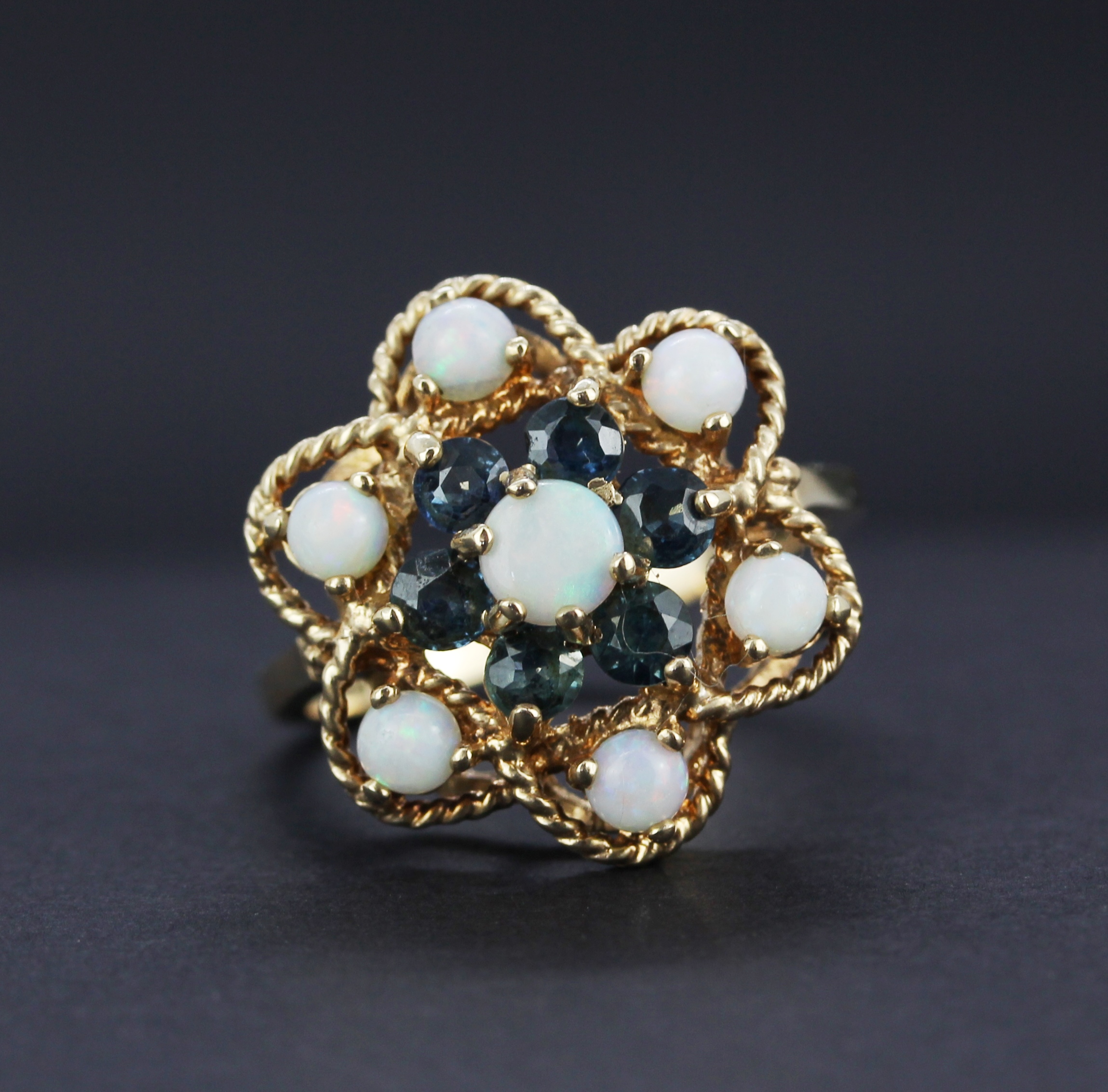 A large hallmarked (worn hallmark) 9ct yellow gold ring set with round cabochon cut opals and - Image 2 of 4