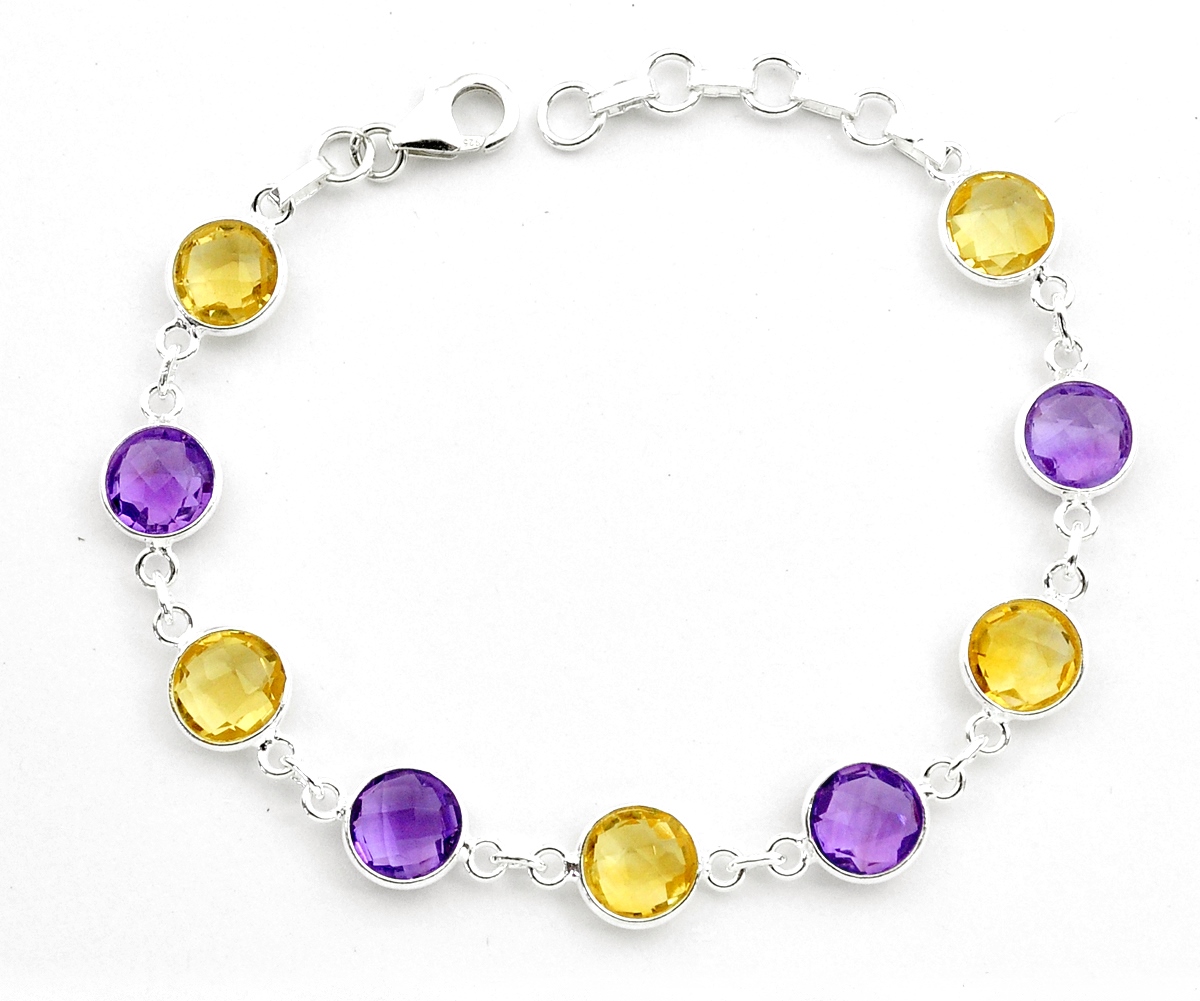 A 925 silver bracelet set with faceted amethysts and citrines, L. 19cm.