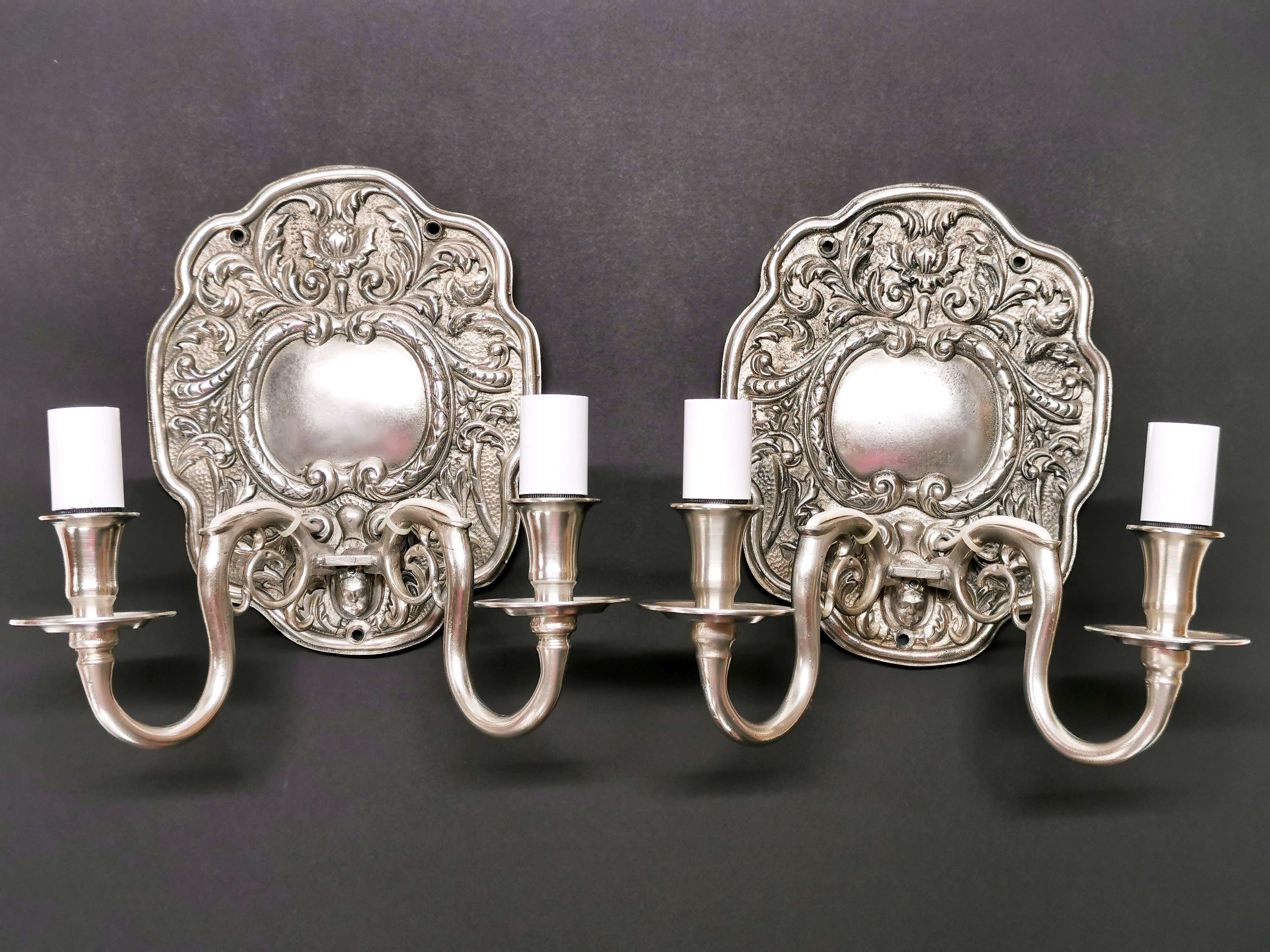 A pair of Albert Bartram reproduction pewter wall sconce electric lights, H. 26cm.
