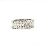 A 925 silver eternity ring set with baguette and rub over round cut cubic zirconias, (M.5).