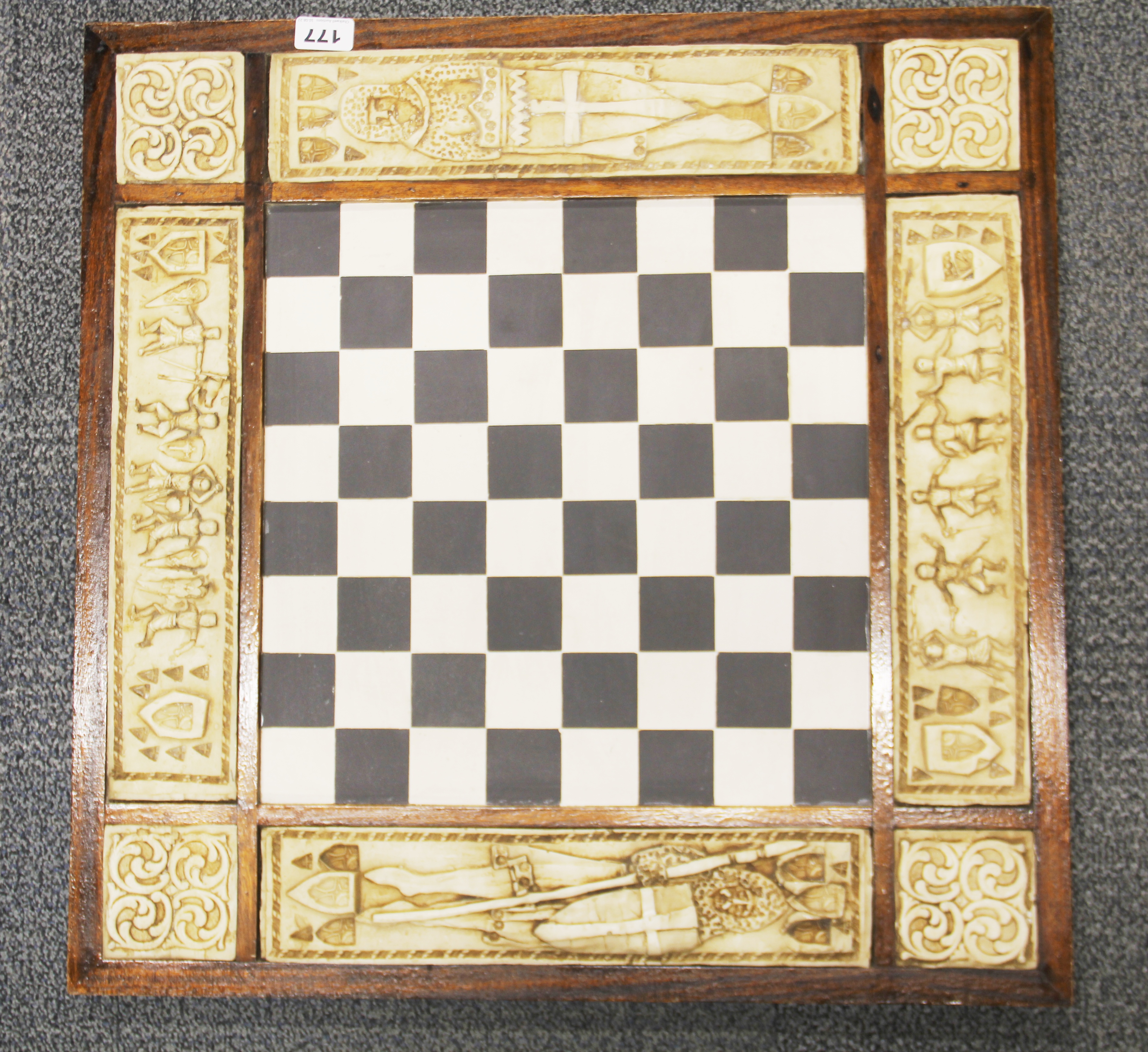 An interesting decorated Medieval style chess board, 63 x 63cm.