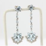 A pair of 925 silver drop earrings set with pear and oval cut blue topaz and cubic zirconias, L.