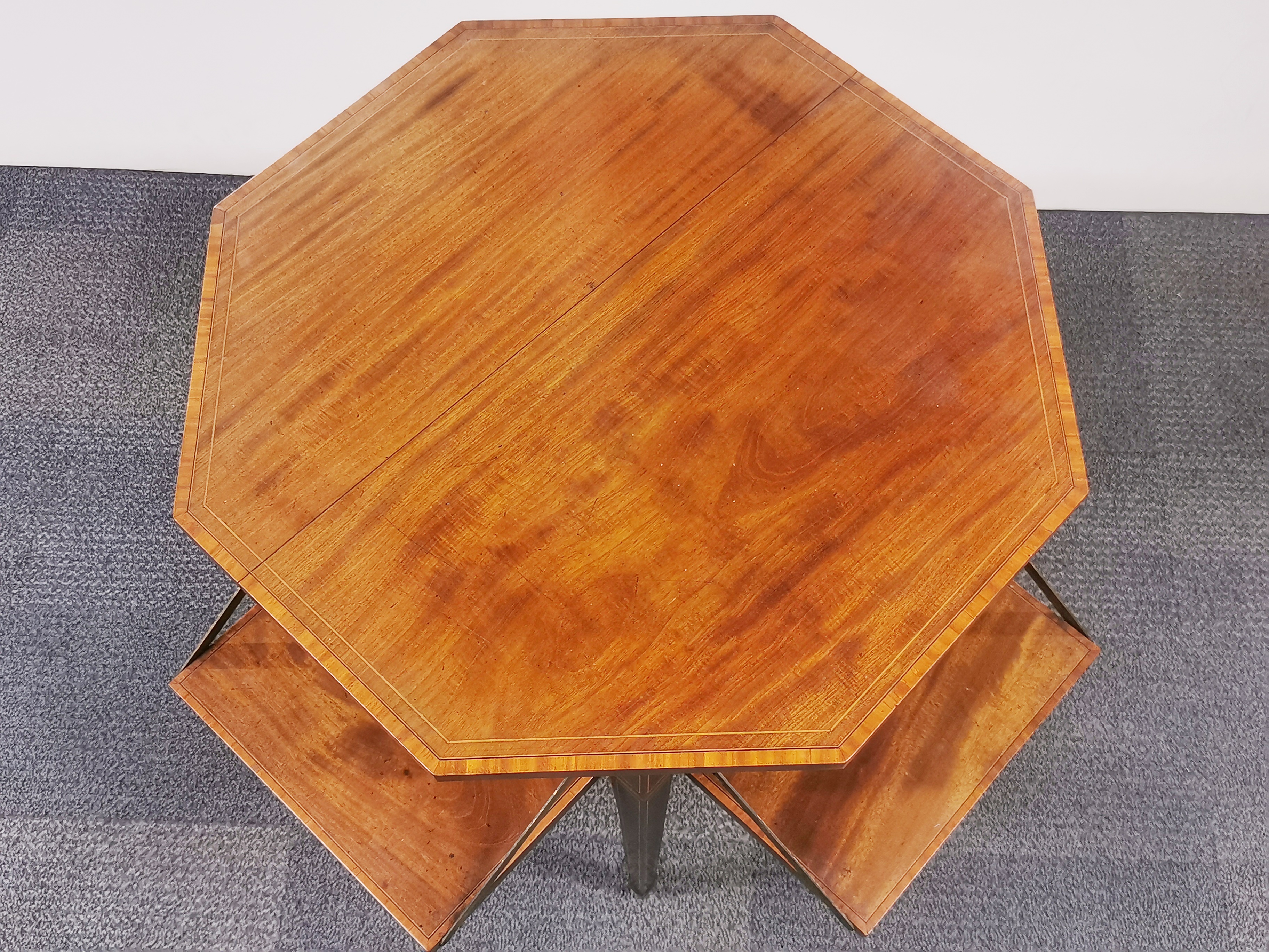 An Edwardian mahogany veneered and inlaid octagonal two-tier table with four interesting fold out - Image 2 of 3
