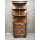 A vintage oak corner cabinet 184 x 70cm.