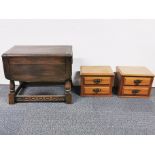 A pair of small light oak chests together with a carved oak drop leaf table, table A/F.