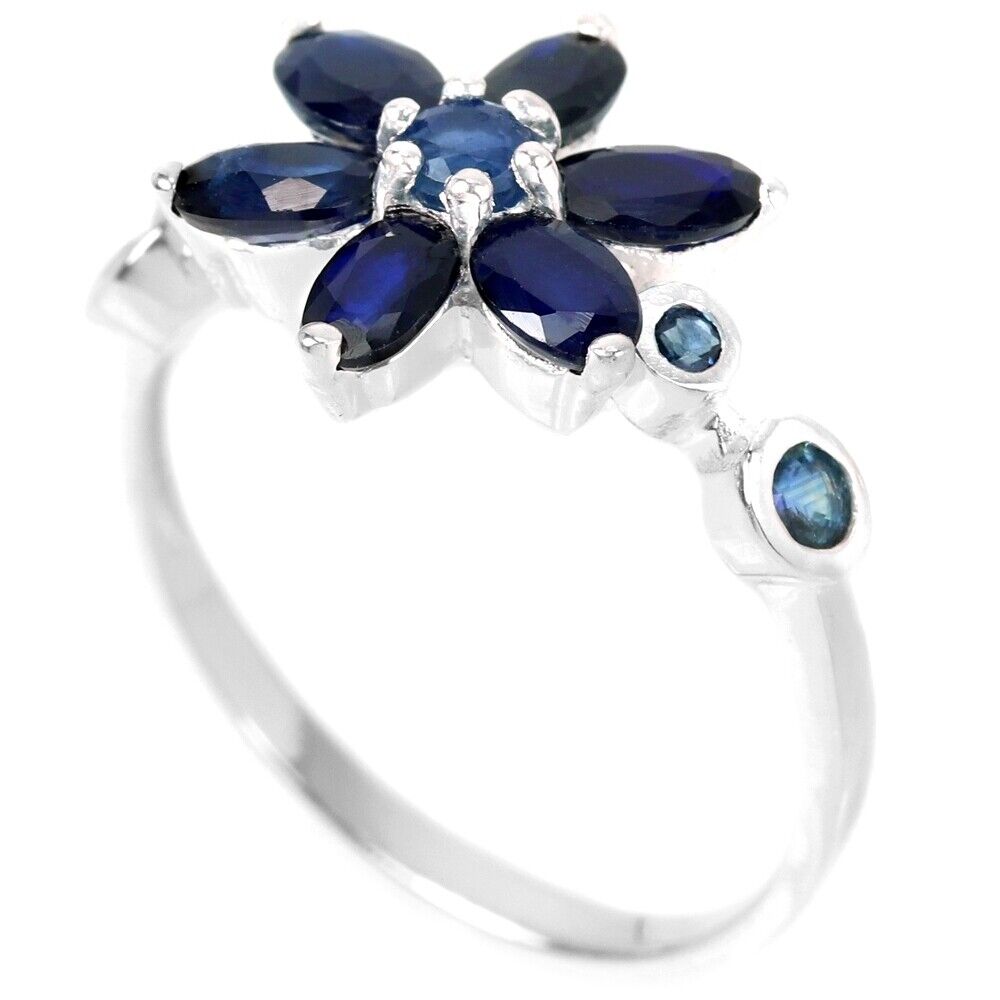A 925 silver flower shaped ring set with oval cut sapphires, (O). - Image 2 of 3