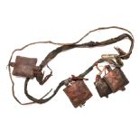 A Tibetan Nomad's leather sash with pouches containing prayers originally from Gyantse, Tibet. Prov.