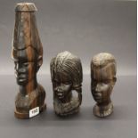 Three African carved figured ebony busts, tallest H. 30cm.