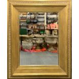 A large gilt framed bevelled glass mirror, W. 122cm, H. 148cm.