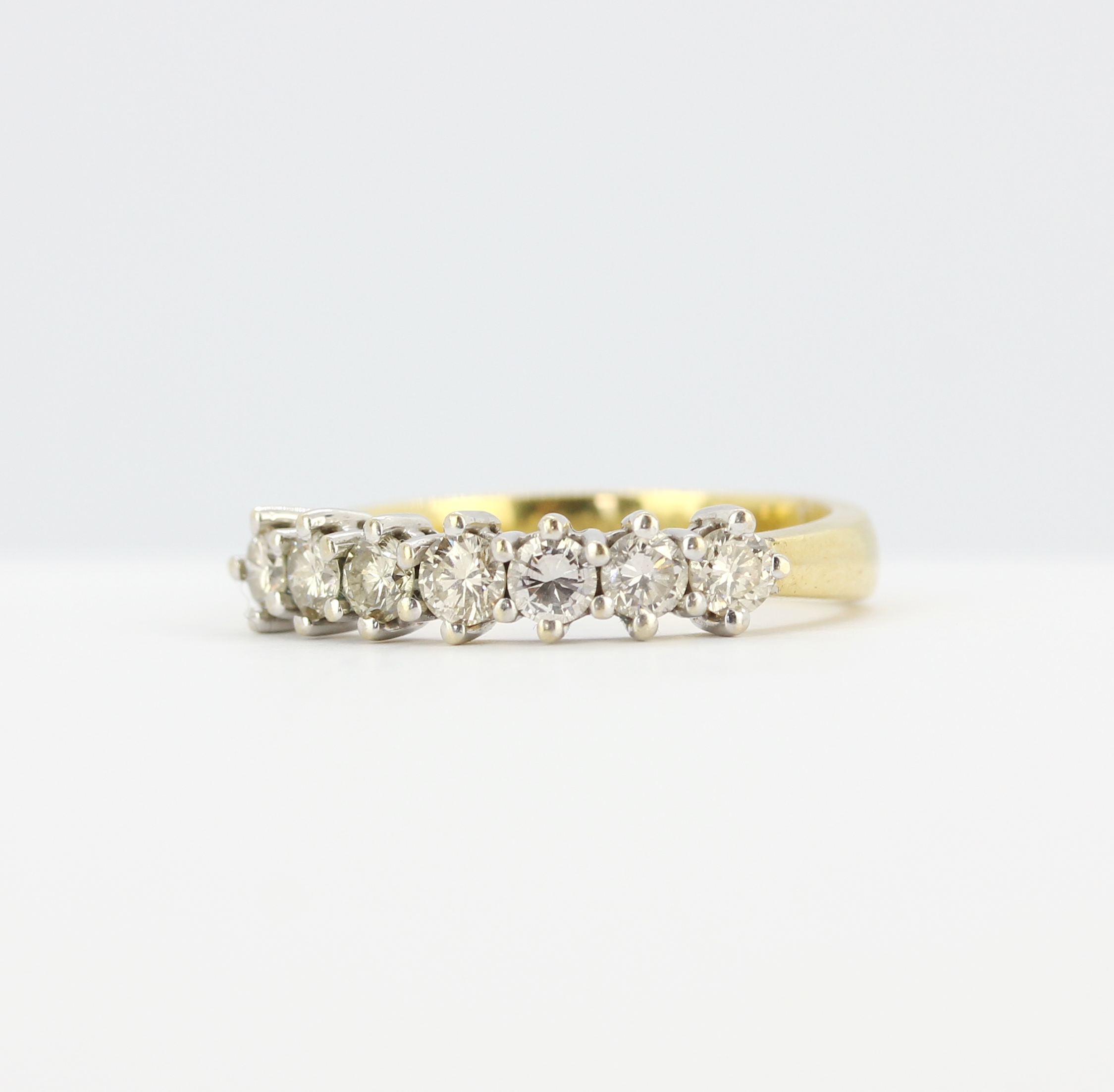 An 18ct yellow gold ring set with brilliant cut diamonds, (N), approx. 0.70ct total. - Image 2 of 3
