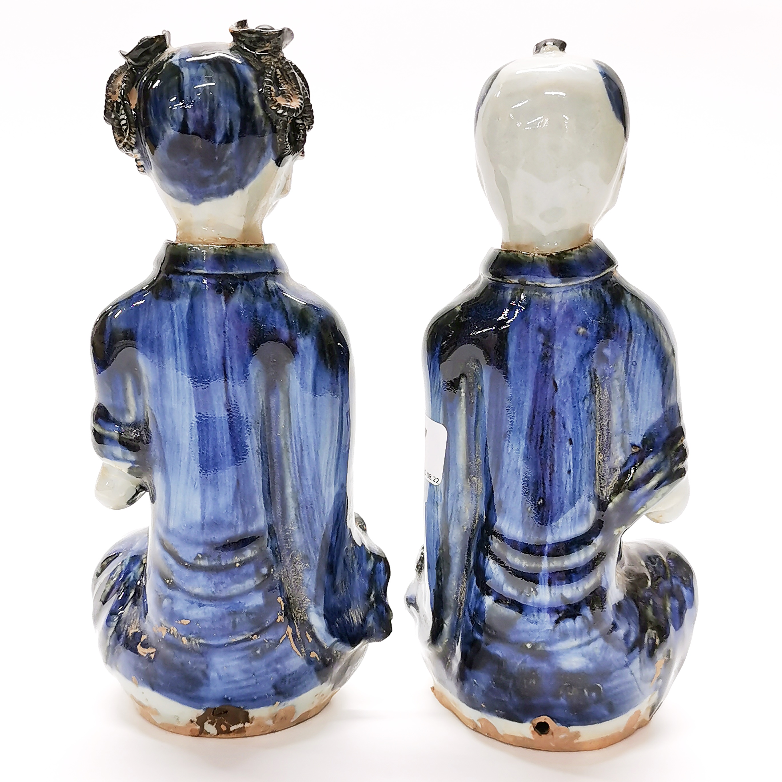 A pair of interesting Chinese glazed handmade porcelain figures of a boy and a girl, H. 23cm. - Image 3 of 4