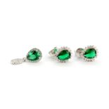 A pair of 925 silver cluster stud earrings set with a pear cut green stone surrounded by cubic