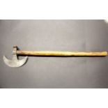 A brass decorated steel and wood tribal axe, L. 59cm. Prov. Estate of the late Dr. James (Jim)