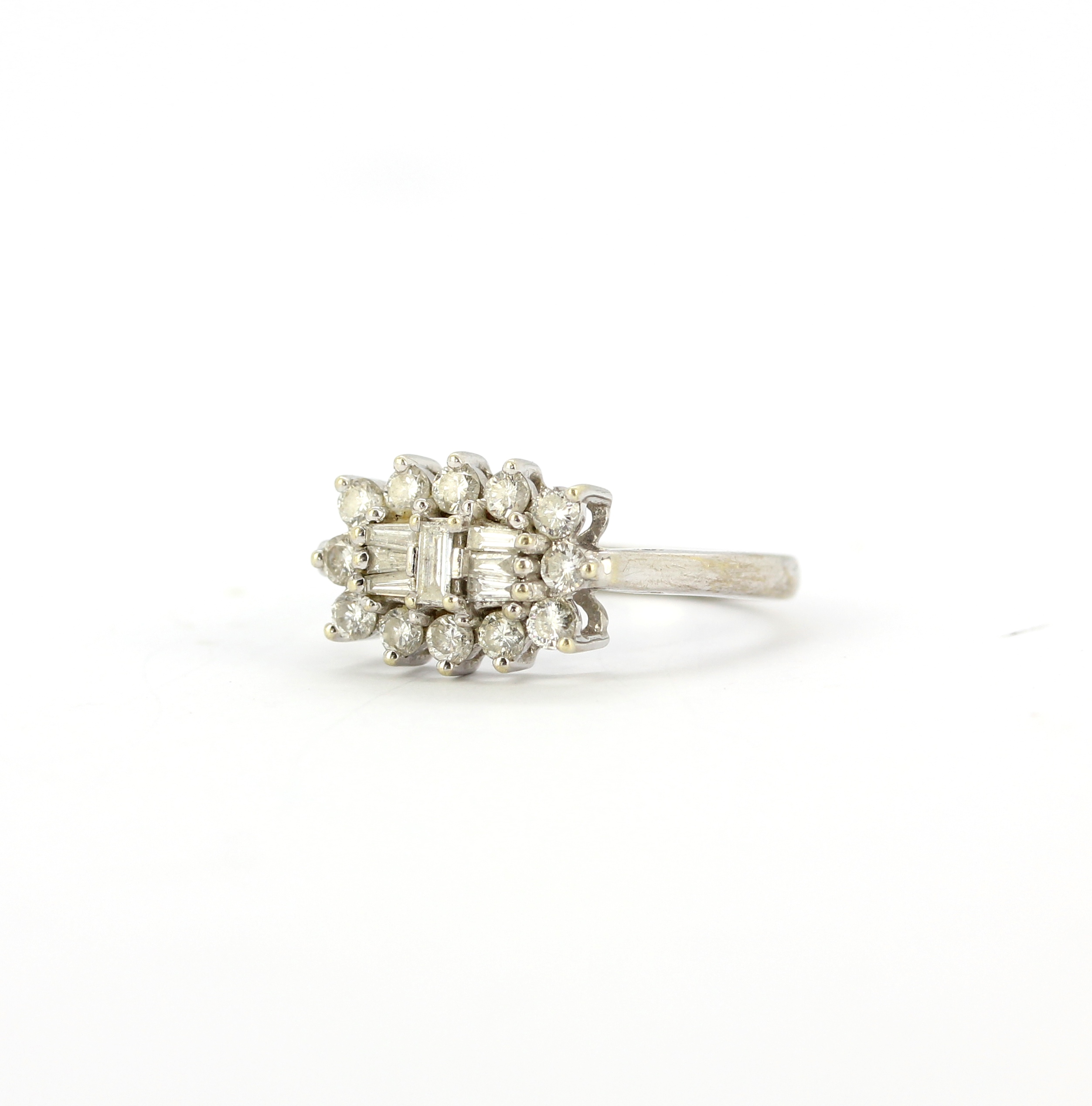 A hallmarked ring set with baguette and brilliant cut diamonds, (M). - Image 2 of 3