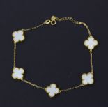 A matching 18ct yellow gold mother of pearl set bracelet, L. 21cm.