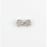 A pair of 14ct white gold cluster stud earrings set with brilliant cut diamonds, L. 0.6cm.