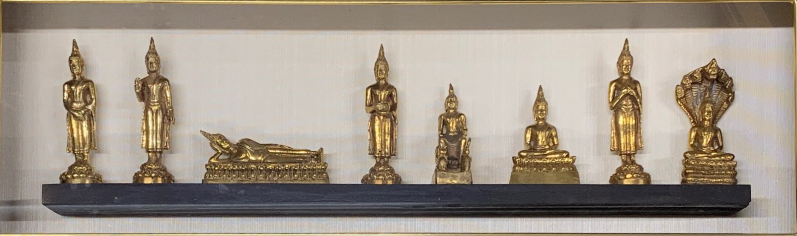 A cased set of Thai Buddhist figures, frame size 74 x 39cm. - Image 2 of 2