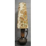 A 1970's German pottery floor lamp with original shade, H. 137cm.